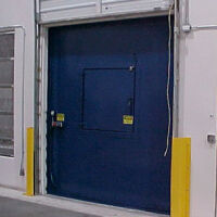 Chute-fed compactor dock inside building Chute-fed compactor dock inside building